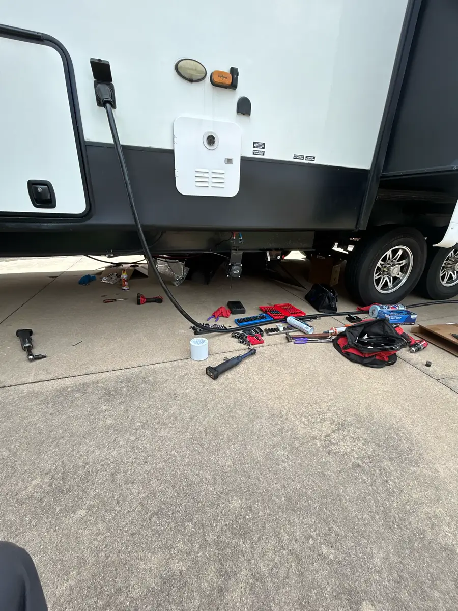 Driveway tool layout for a mobile RV repair visit.